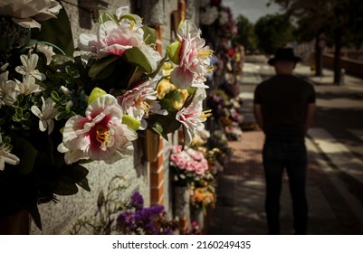 Rear View Of Adult Man Mourning In Cemetery. Madrid, Spain