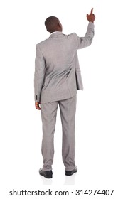 Rear View Of African American Businessman Pointing At Empty Space