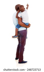 Rear View Of African American Father And Son Pointing Copy Space