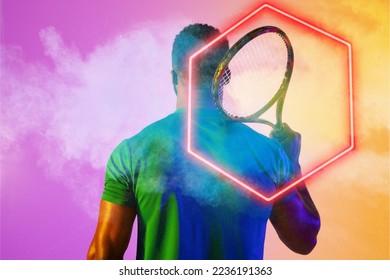 Rear view of african american male tennis player holding racket amidst smoke by illuminated hexagon. Copy space, composite, sport, shape, competition, playing, match and abstract concept. - Powered by Shutterstock