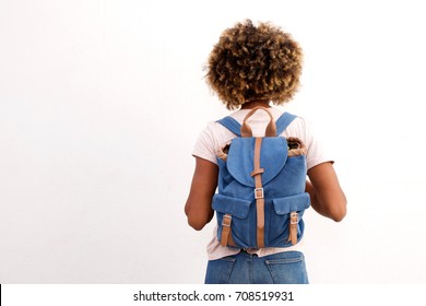 Rear view of african female student with bag against white background - Powered by Shutterstock
