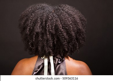 Rear View Of An All Natural African American Woman's Hair.