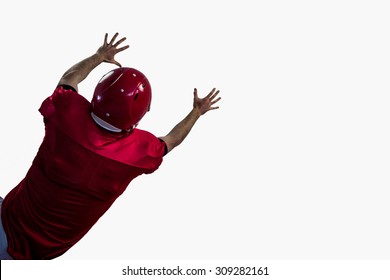 Rear view of american football player trying to catch football against white background - Powered by Shutterstock