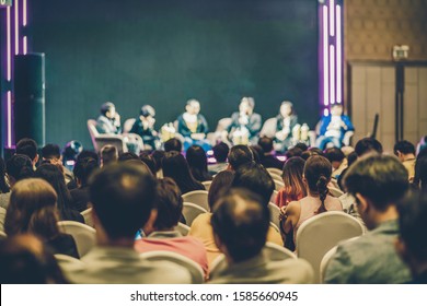 Rear View Of Asian Audience Joining And Listening Group Of Speaker Talking On The Stage In The Seminar Meeting Room Or Conference Hall, Business And Education, Associate And Startup Business Concept