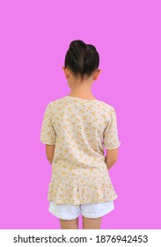 Rear View Of Asian Little Child Girl With Bun Hair Up Isolated On Pink Background