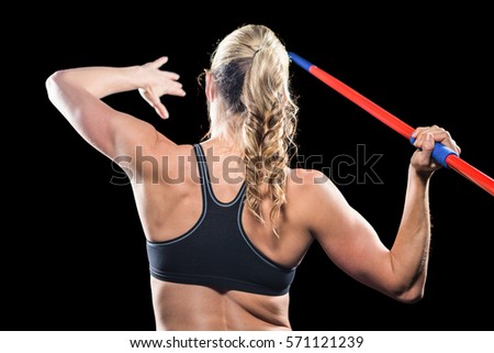 Similar – Close up side view profile portrait of one young athletic woman shadow boxing in sportswear in gym over dark background, looking away