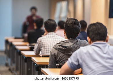 Rear View Of Audience Listening The Asian Speaker On The Stage In The Meeting Room Or Conference Hall Over,seminar Business And Education Concept