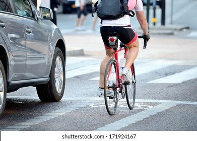 Rear View Of Bicyclist In Full Gear