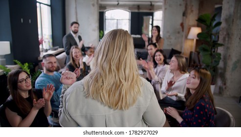 Rear View Blonde Female Boss Business Woman Motivating Multiethnic Employees, Team Clap At Office Seminar Slow Motion.