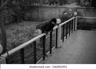 Rear View Of A Burglar Entering In A House