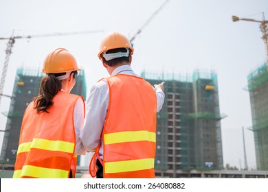 Rear View Of Business Partners At The Construction Site