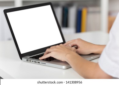 Rear view of business woman hands busy using laptop at office desk, with copyspace