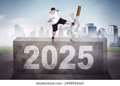 Rear view of businessman carrying a briefcase while walking on the stairway toward 2025 new year numbers - Powered by Shutterstock