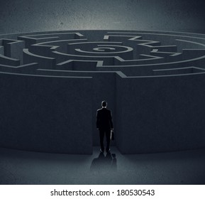 Rear view of businessman entering round white labyrinth - Shutterstock ID 180530543