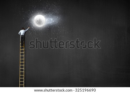 Rear view of businessman standing on top of ladder