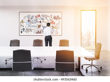 Rear View Of Businessman Working At Graph On Whiteboard In Sunlit Board Room Of Large Company. Concept Of Presentation. 3d Rendering. Toned Image