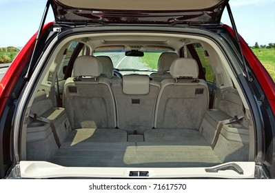 Rear View Of A Car With An Open Trunk