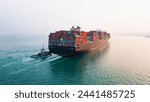 Rear view cargo container ship. Business logistic transportation sea freight, Cargo ship, Cargo container in deep sea port at industrial estate for import export around in the world