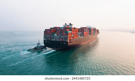 Rear view cargo container ship. Business logistic transportation sea freight, Cargo ship, Cargo container in deep sea port at industrial estate for import export around in the world - Powered by Shutterstock