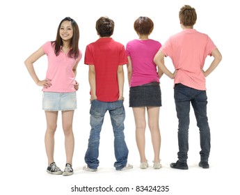 Rear View Of A Casual Group Of People With A Woman Facing The Camera