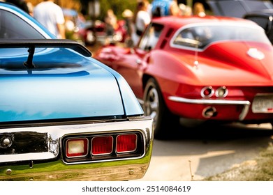 Rear view of classic 60s muscle cars at vintage automotive exhibition.  - Powered by Shutterstock