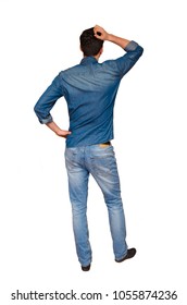 Rear View Of A Clueless Young Man In Casual Clothes, Isolated On White