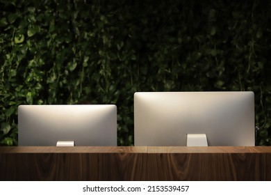 Rear View Of Computer Monitors In The Office