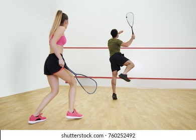 Rear View Of Couple During The Squash Game 