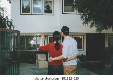 Rear View Couple Sadly Bid Farewell To Their Old House And Misses Their Back Because They Had To Move To Their New Home Because Of Financial Debt.
