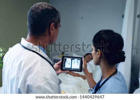 Similar – Female doctor showing an x-ray on the tablet