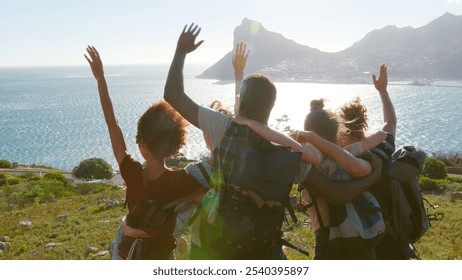 Rear View Of Group Of Young Friends Hiking Standing On Cliffs By Coast And Looking At Beautiful View - Powered by Shutterstock