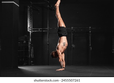 Rear view of handstand exercise, handstand push-ups. Routine workout for physical and mental health. - Powered by Shutterstock