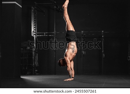 Rear view of handstand exercise, handstand push-ups. Routine workout for physical and mental health.