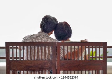 Rear View Of A Happy Asian Middle Aged A Couple On Bench