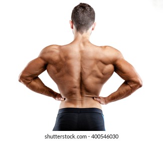 Rear view of healthy muscular young man with his arms stretched out isolated.  - Powered by Shutterstock