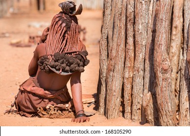 Rear View Of Himba Woman Outside Shack