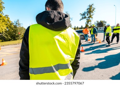 A rear view of an industrial man engineer at  factory - Powered by Shutterstock