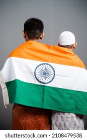 Rear View Of Kid Indian Flag On Multi Religious Kids Shoulder On Gray Background - Concept Of Freedom, Friendship, Unity In Diversity, Nationalism And Patriotism.