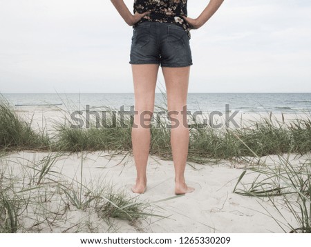 Similar – Young, long-legged, slim woman on the beach