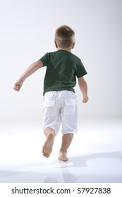 Rear View Of A Little Boy Running