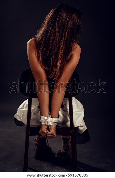 Girl Tied To Table