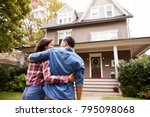 Rear View Of Loving Couple Walking Towards House