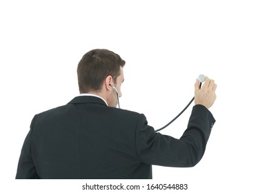 Rear View Of Male Doctor In Black Suit Holding Stethoscope Isolated On White Background