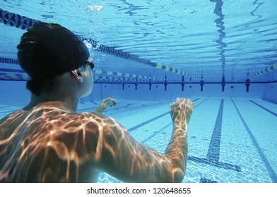 Rear View Of A Male Swimmer Ready To Swim Underwater