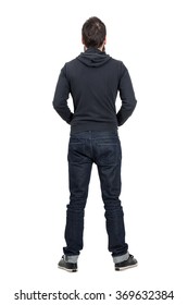 Rear View Of Man In Black Hooded Shirt With Rolled Up Jeans. Full Body Length Portrait Isolated Over White Studio Background. 