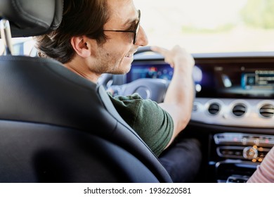 Rear View Of Man Driving In The Car                               