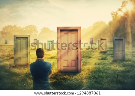 Rear view man in front of many different doors choosing one. Difficult decision, concept of important choice in life, failure or success. Ways to unknown future career development. Opportunity symbol.