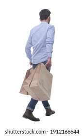 rear view. man with shopping bags walking away.