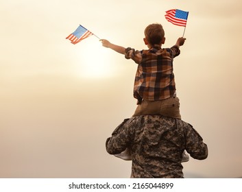 Rear View Of Military Man Father Carrying Happy Little Son With American Flag On Shoulders And Enjoying Amazing Summer Nature View On Sunny Day, Happy Male Soldier Dad Reunited With Son After US Army