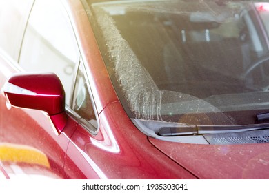 Rear View Mirror Exterior Outside Covered With A Layer Of Dust Closeup Of A Dry Dirty Red Car With Rubber Blades On Wipers Of Windscreen, Nobody.